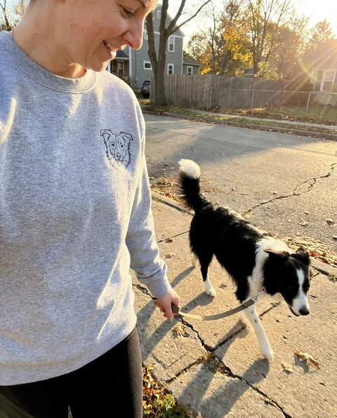 Sport grey pet portrait crewneck sweatshirt worn on a walk with the border collie pictured in the line art